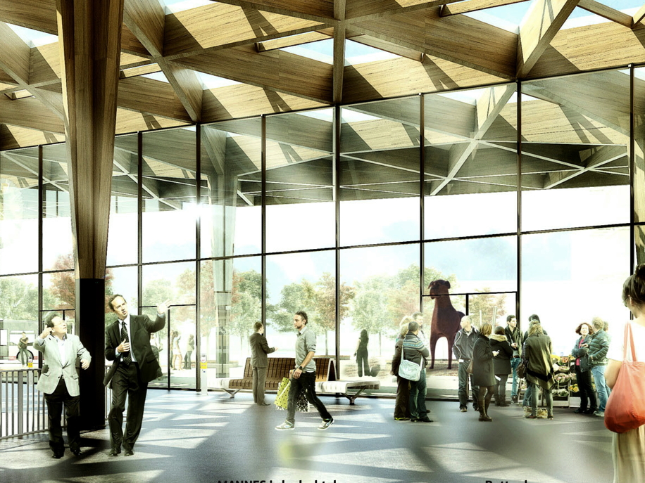 mannes staat voor het station